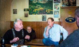 Peter Hampel, right, with other AFD supporters in the back room of a former petrol station