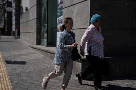 People rush to take shelter during a Russian attack on Kyiv.