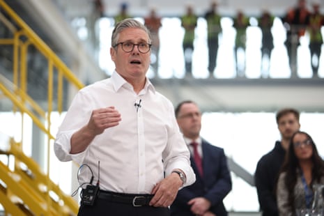 Keir Starmer speaks to workers during a visit to Glass Futures in St Helens, Merseyside, on Thursday.
