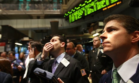 Traders work on the floor of the New York Stock Exchange in 2008