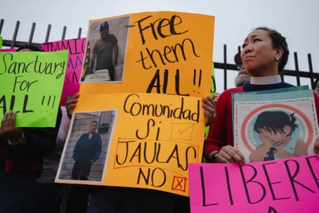A woman holds a sign during a press event held by family members of people detained by ICE on June 9, 2025 in Los Angeles, California.