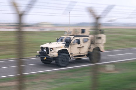 An LTV (light tactical vehicle) operates at the perimiter of the RAF Fairford airbase.