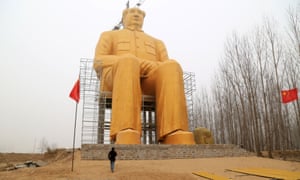 A visitor shows the scale of the huge statue.