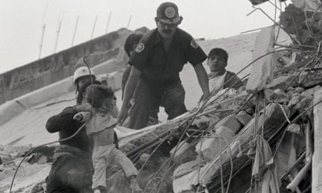 A child is pulled from earthquake wreckage