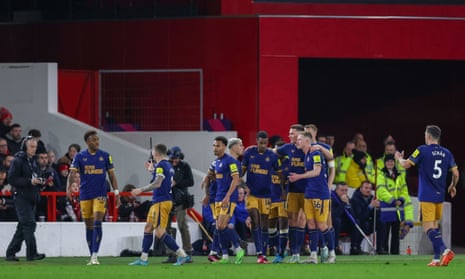 Newcastle United forward Alexander Isak (14) is congratulated by his teammates after putting the visitors level with a fine finish.