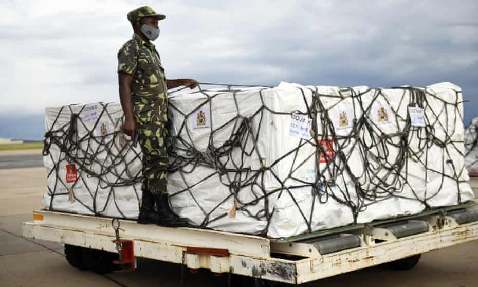A policeman guards a shipment of Covid vaccines at Kamuzu airport in Lilongwe, Malawi.