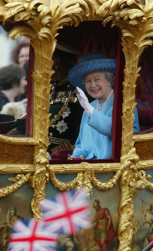 2002: Elizabeth, accompanied by Prince Philip, waves as she rides in the gold state coach from Buckingham Palace to St Paul’s Cathedral for a service of thanksgiving to celebrate her golden jubilee