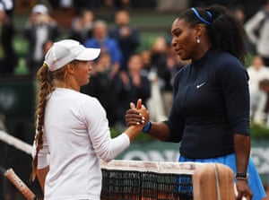 Williams shakes hands at the net with the defeated Yulia Putintseva at the finish.