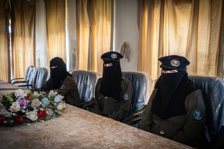 Three women from the women’s police corps seen in Marib police headquarters. Dressed in a black niqab and a beret stamped with the national eagle, there are 300 of them in all
