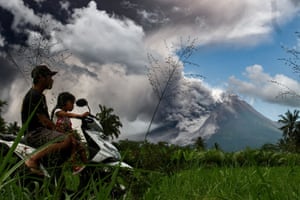 Thick smoke rises during an eruption from Mount Merapi, Indonesia’s most active volcano, as seen from the village of Tunggularum in Sleman