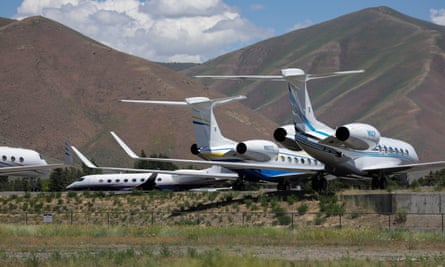 Private jets are seen on the tarmac