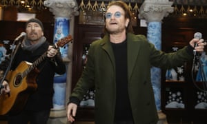 The Edge and Bono of U2 take part in the annual Christmas Eve busk in Dublin.