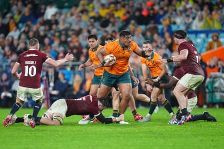 Australia’s Will Skelton (centre) is tackled round his lower legs by British & Irish Lions’ Jack Conan during the third and final Test in Sydney