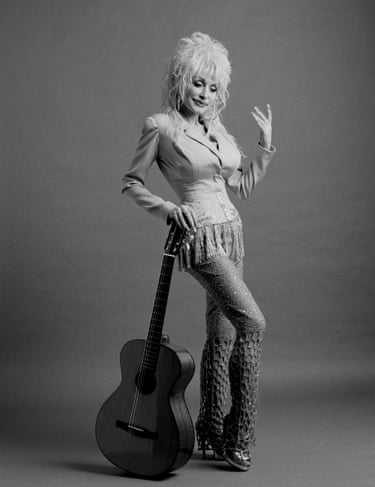 a women against a guitar