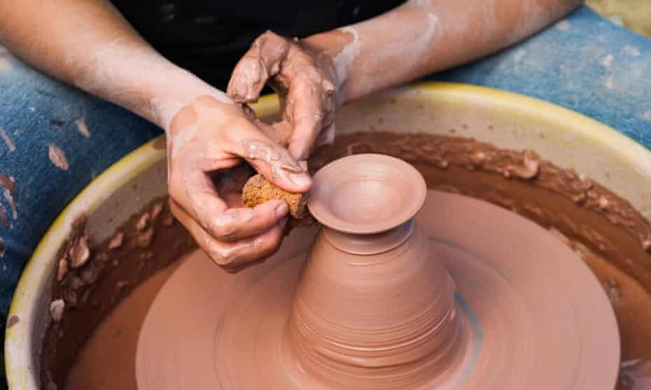 ‘And your hands chance no amateur magic’ ... a man making a clay bowl on a potter’s wheel.