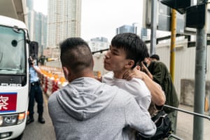 Police arrest an activist outside West Kowloon court at a sentencing hearing of seven pro-democracy leaders in Hong Kong, including Jimmy Lai, founder of the Apple Daily newspaper, and the former lawmakers and barristers Martin Lee and Margaret Ng, who were convicted of unauthorised assembly at a peaceful protest in 2019.