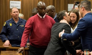 Oscar Pistorius holds his sister Aimee Pistorius as he leaves the High Court in Pretoria, on July 6, 2016 after beeing sentenced to six years in jail for murdering his girlfriend Reeva Steenkamp.
