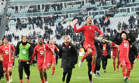 Monza players celebrate victory at the Allianz Stadium.