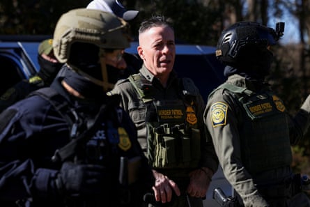 Man in between border agents