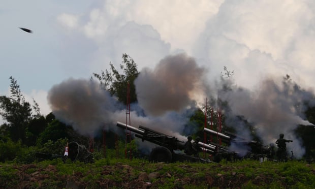 Taiwanese soldiers fire artillery during a live-fire drill in Pingtung