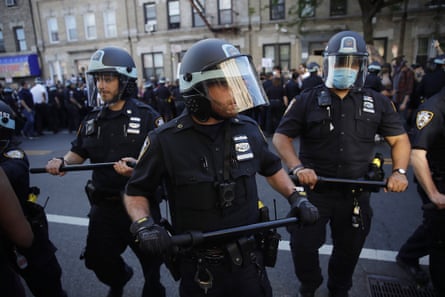 New York City Police officers and protesters clash during a demonstration in Brooklyn on 30 May.