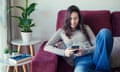 Teenage girl using online dating app.<br>Millennial teenage girl on couch using smartphone to find love, partner and boyfriend. Online dating, romance, realtionships, beginnings