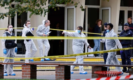 French police officers from the forensic service stand in front of the Gambetta-Carnot school following the attacks.