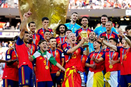 Dani Olmo lifts the World Cup after Spain’s win against Argentina.