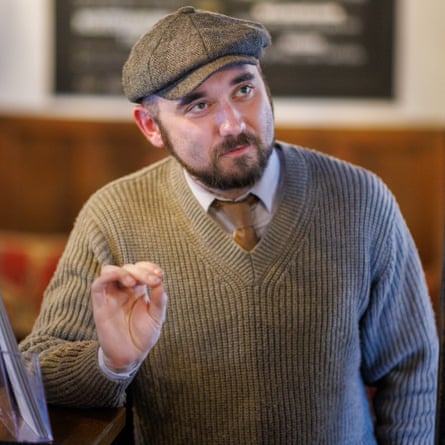 Morton leans against the bar while talking to Osbourne.