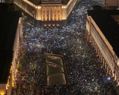 This drone aerial photograph shows the crowd shine their mobile phones as tens of thosands of protesters gather in central Sofia to demonstrate against the Bulgarian government in Sofia.
