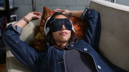 A NuCalm press image shows woman wearing eye mask, patch and headphones