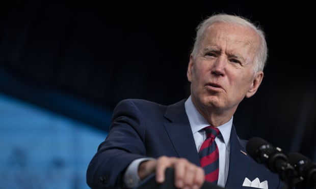 Close-up of Joe Biden, shot at a slight angle as he speaks from a podium at the White House