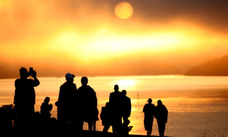 People watch the sun rise from the Treaty Grounds in Waitangi, New Zealand. The Mana Motuhake policy is based on Māori asserting their right to self-management, self-determination, and self-governance over all their domains.
