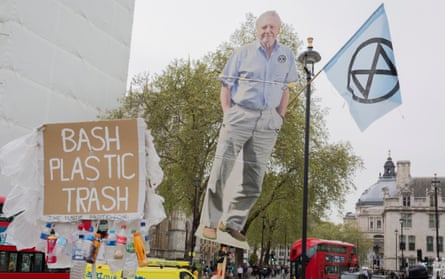 Extinction Rebellion protesters hold up an image of David Attenborough in Parliament Square in April.