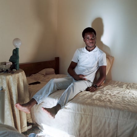 A man sits on a bed
