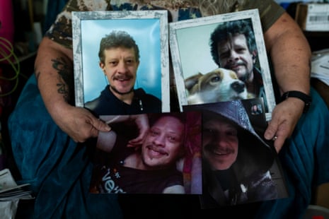 Grady holds four portraits of Giesel, including one with Buddy in his lap
