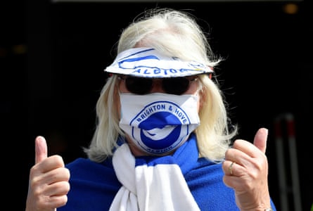 A Brighton fan looks pleased to be back at the Amex.