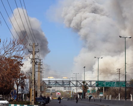Large smoke plumes above urban highway