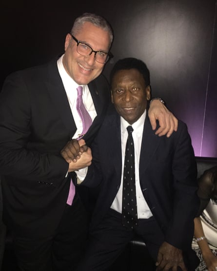 two men smile side by side