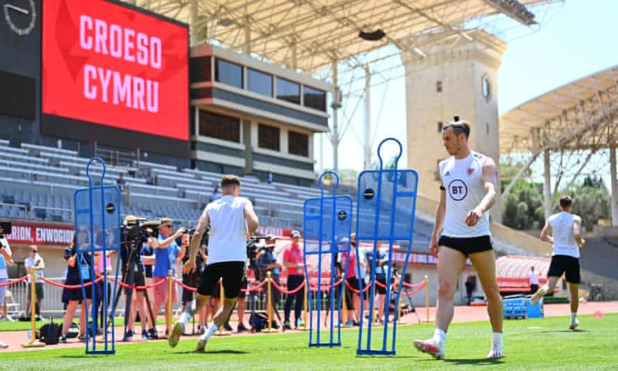 A sign reads ‘Welcome Wales’ as Gareth Bales and the squad train.