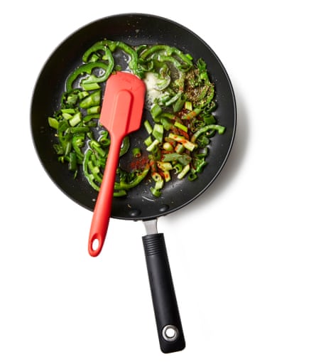 Put the oil in a medium frying pan on a medium-low heat, then saute the peppers, along with a good pinch of salt, and the yellow/red onion, if using, for about five minutes, until soft. Stir in the butter, spring onions, if using, pul biber and oregano, if using, fry, stirring, for a couple of minutes more