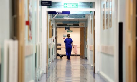 Nurse walks in hospital corridor