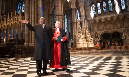 Ramaphosa walks with the dean of Westminster, David Hoyle, during a visit to Westminster Abbey