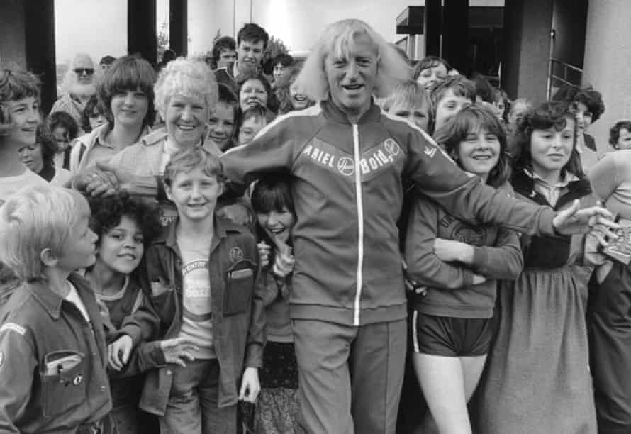 Jimmy Savile on a charity jog around Coventry in 1979 – one of the much-publicised charitable acts he used to justify his crimes.