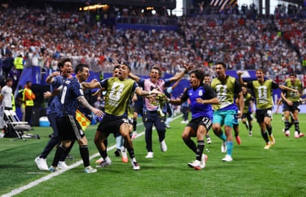 Argentina's Lionel Messi celebrates with teammates after Lautaro Martínez scores their second goal.