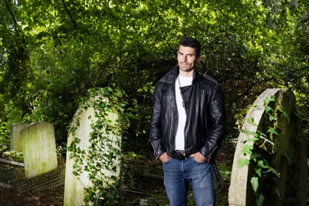 A man standing in a cemetery