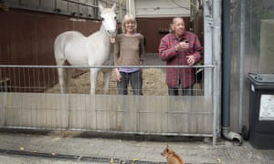 Jenny is next to her owners Anna (C) and Werner Weischedel as she prepares for her daily walk in Fechenheim, near Frankfurt am Main, western Germany, on April 28, 2020.