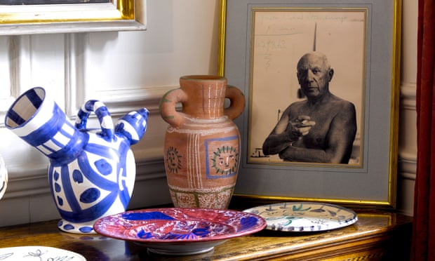 A photograph of Pablo Picasso and a selection of ceramics owned by Lord and Lady Attenborough.