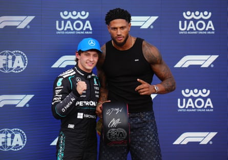 Maduka Okoye presents Kimi Antonelli with his pole position award after qualifying for the British GP