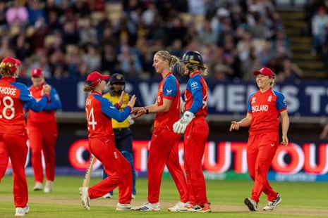 Freya Kemp is congratulated by her England teammates after taking the wicket of Sugandika Kumari.